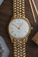 Patek Philippe ref. 2526 in YG w. Bracelet: Retailed by Somazzi (c. 1953)
